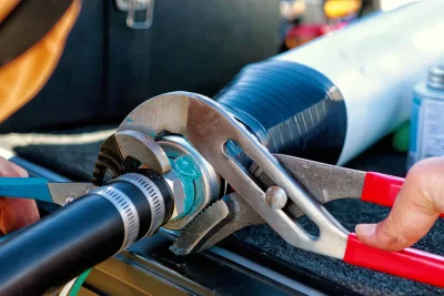 Pipe repair service using professional plumbing tools in Englewood, Florida